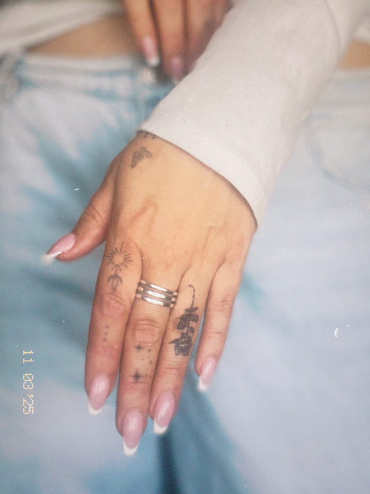 semi-permanent tattoos on hand, fingers. Temporary tattoos for styling.